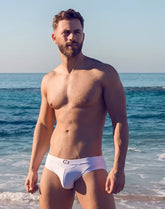 White vb13 swim brief with subtle logo on waistband made of comfortable material for swimming use