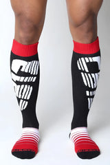 Black knee high socks velocity 2.0 with white cellblock 13 logo and red ribbed cuffs and toe sections