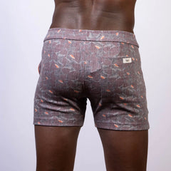 Back side of vintage stripes linen texture shorts in gray with subtle weave and orange fish motifs with branded label