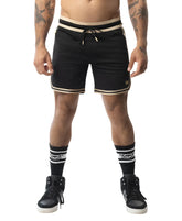Black warm up rugby shorts with beige trim and drawstring waistband designed for athletic use