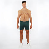 Dark green slim-fit washed denim stretch knit shorts with classic five-pocket design