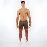 Olive green washed denim stretch knit shorts with textured fabric for comfortable casual wear