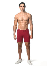 Red washed denim stretch knit men’s shorts with classic fit and button closure for casual wear