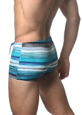 Blue and white striped swim trunks with a textured watercolor stripe printed pattern for beachwear