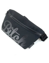 Black fabric WERDS ultra slim fanny pack with gray cursive bitch graphic and zipper closure for hands free use