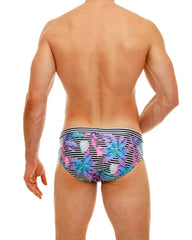 Wild mango swim brief featuring vibrant tropical print swim trunks with bold black and white striped waistband