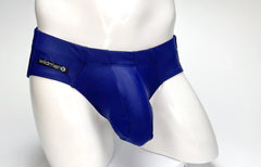 Royal blue glossy latex swim briefs with black wildman brand label on waistband big boy pouch design