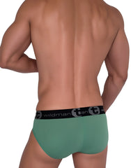 Green cotton briefs with black elastic waistband featuring the wildman tan logo from wildmant cotton monster cock brief