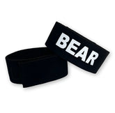 Black elastic wristband with bold white bear lettering for wildmant fetish max cock-ring bear accessory