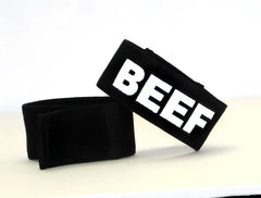 Black fabric wristband with bold white beef lettering for wildmant fetish max cock-ring beef product