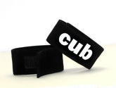 Black velour wristband with white cub logo from wildmant fetish max cock-ring-cub collection