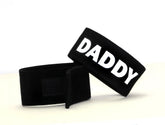 Black velour wristband with bold white daddy lettering from wildmant fetish max cock ring daddy product