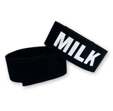 Wildmant fetish max cock-ring made of black elastic wristband with bold white milk lettering