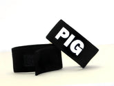 Black fabric wristband with white embroidered pig lettering from wildmant fetish max cock ring pig product