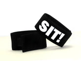 Black elastic wristband with bold white sit lettering from wildmant fetish max cock-ring-sit product line