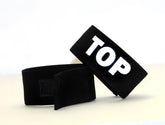Black velour wristband with white embroidered top lettering for wildmant fetish max cock-ring-top product