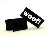 Black velour pet collar strap with bold white woof lettering from wildmant fetish max cock-ring-woof product