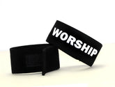 Black wildmanT fetish max cock-ring wristband with bold white worship lettering and velcro closure