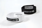 White and black elastic wristbands with wildman plus branding for wildmanT max cock-ring accessory