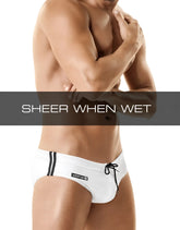 White men’s swim trunks with black side stripes and wildman logo waistband in wildmant sport bikini swim w ball lifter cock ring white