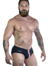 WildmanT sportivo bikini black swim trunks with red and white side stripes and wildman logo on left leg
