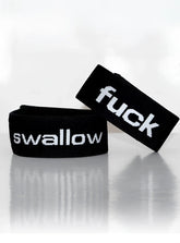 Black elastic wristband with white embroidered text fuck and swallow part of wildmant verbal max cock-ring fuck product