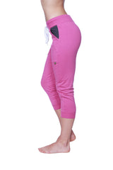 Women’s berry capri yoga pants with charcoal cuff, black pocket, and white drawstring waistband in lightweight fabric