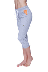 Women’s heather grey cuffed capri yoga pant with white drawstring and orange accent pocket in gray heathered fabric