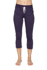 Women’s navy blue capri yoga pants with white drawstring waistband and side pockets for activewear and comfort