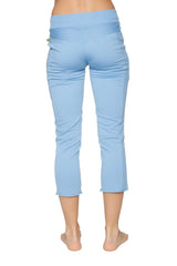Women’s sky blue capri yoga pants with a high-waisted design, stretchy fabric, subtle side ruching, and zipper pockets