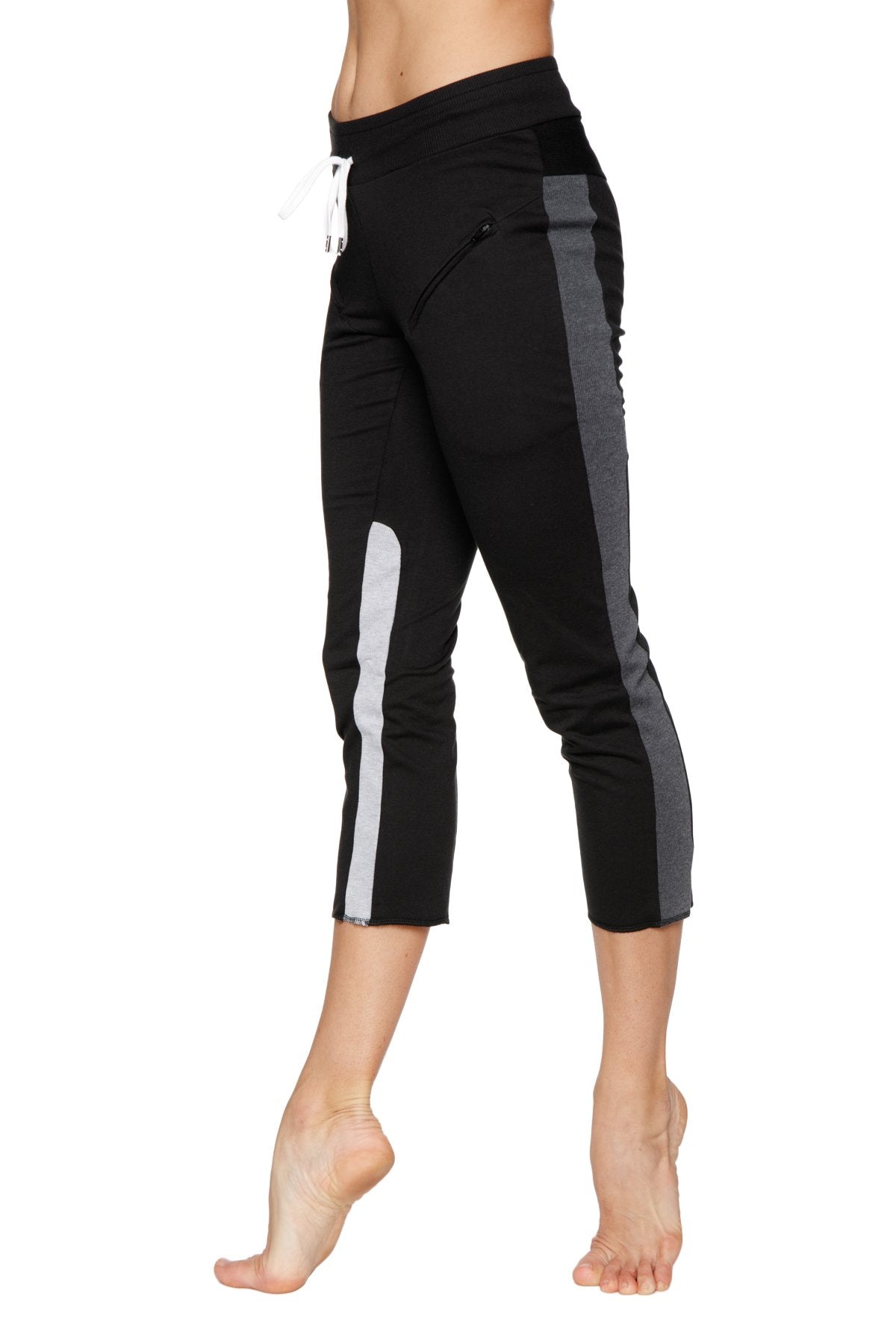 Women’s black capri yoga pants with charcoal and grey side stripes and a drawstring waistband