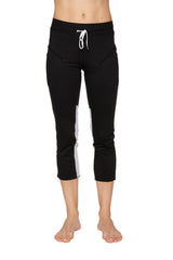 Women’s black 4/5 length zipper pocket capri yoga pant with white side stripes and matching drawstring waistband