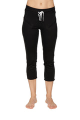 Women’s black 4/5 length capri yoga pants with white drawstring waistband and zipper pockets for athletic use