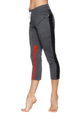 Women’s charcoal capri yoga pants with black and red side stripes and white drawstring waistband with zipper pockets