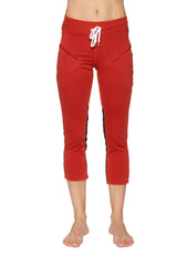 Women’s cinnabar 4/5 length capri yoga pants with black side stripes and white drawstring waistband