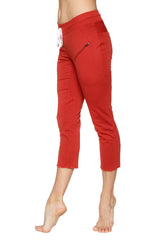 Women’s cinnabar red 4/5 length capri yoga pants with white drawstring waistband and zipper pockets