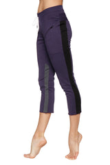 Women’s eggplant capri yoga pants with black and charcoal side panels white drawstring waistband and zippered pockets