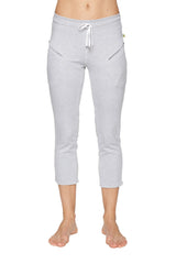 Light gray women’s 4/5 length capri yoga pant with white drawstring waistband and diagonal zipper pockets