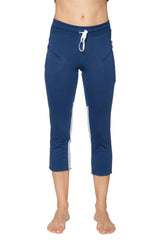 Women’s navy blue capri yoga pants with white side panels and drawstring waistband for activewear use
