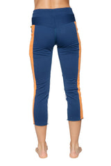 Women’s 4/5 length zip pocket capri yoga pants in royal blue with orange and grey high-waisted athletic design