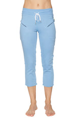 Women’s sky blue 4/5 length capri yoga pants with white drawstring waistband and black zipper pockets