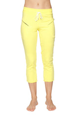 Women’s 4/5 length zipper pocket capri yoga pant in bright yellow with white drawstring waistband and black zipper accents