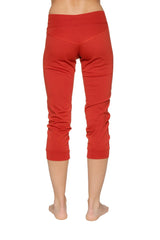 Women’s red cuffed jogger yoga pant with stretchy form-fitting fabric and subtle ruching at the lower legs