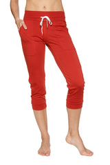 Women’s cinnabar red capri-length jogger yoga pant with white drawstring waistband and side pockets