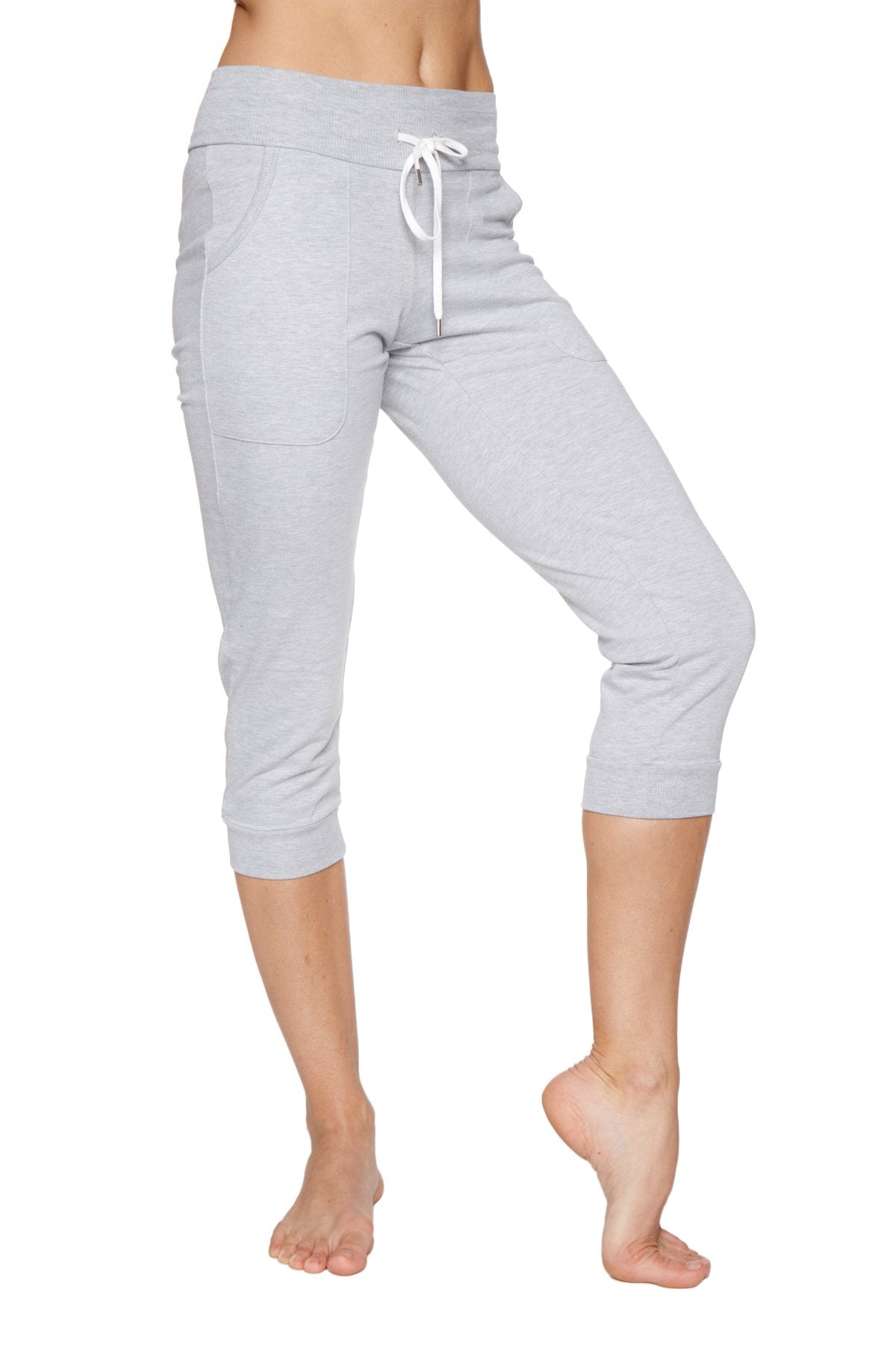 Light gray cuffed capri-length jogger yoga pants with drawstring waistband and side pockets for women