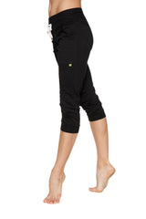 Women’s solid black cuffed jogger yoga pants with drawstring waistband and side pockets in capri length