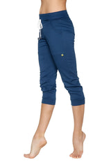 Women’s cuffed jogger yoga pant in solid royal blue with white drawstring waistband and side pockets in navy blue stretchy fabric