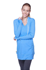 A bright blue women’s long body hoodie top with v-neckline white drawstrings and long sleeves in ice blue with royal blue accents