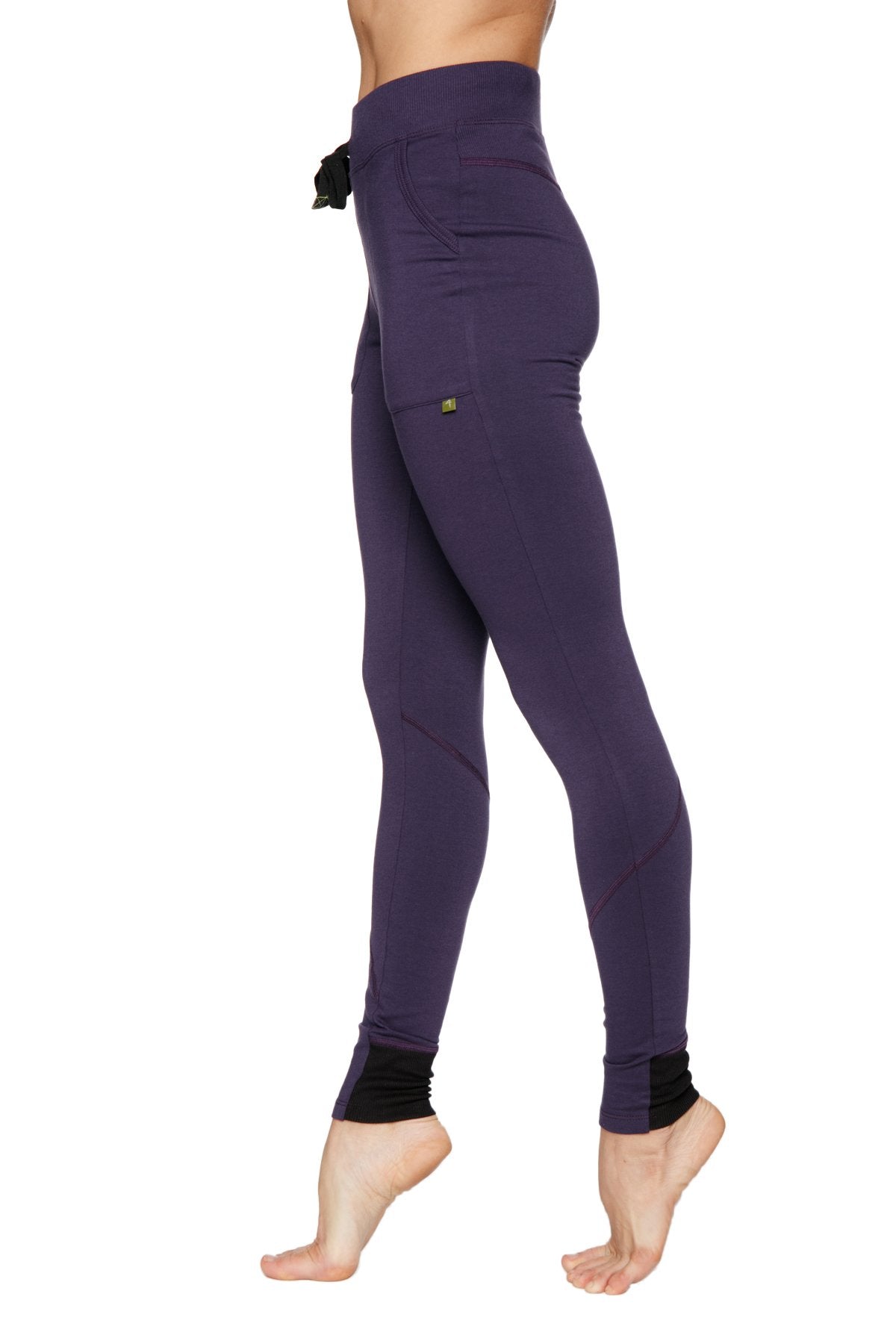 Women’s straight-leg long performance yoga pant in purple with black drawstring waistband and ribbed cuffs