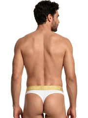 White microfiber thong by Xtremen with a gold elastic waistband featuring repeating gold logo branding.